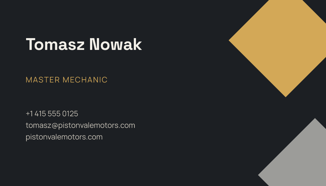 The Graphite Facet business card design filled in for Tomasz Nowak, Master Mechanic at Pistonvale Motors, with a phone number, an email, a website and a QR code.